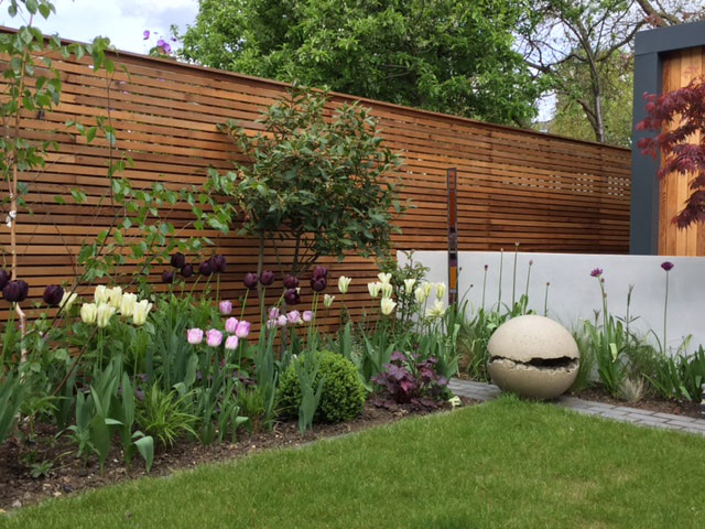 Cedar baton fence ad tulips